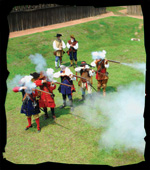 Demonstration of reenactors firing blackpoweder muskets at the Mision San Luis' fort, Castillo de San Luis.